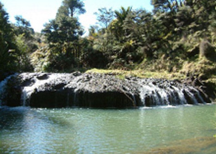 A very interesting fall over what appears to be volcanic rock, into a delightful pool, downstream
