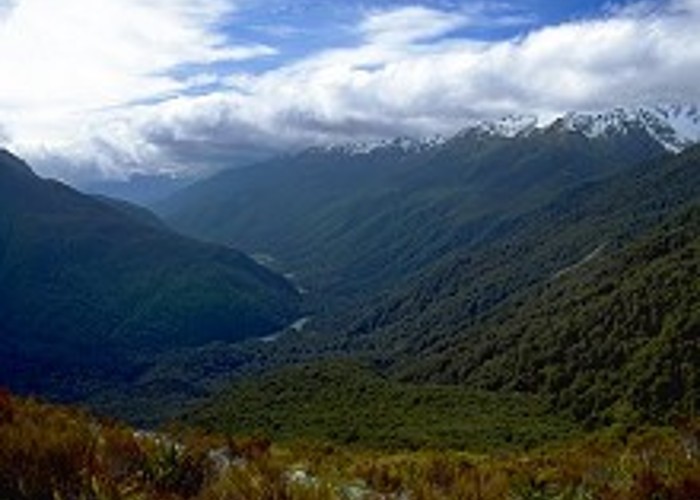 The Hollyford Valley floor sits just above sea level, while the Routeburn Track creeps along the Serpentine Range at around 1000m. The snowy basin obscured at right holds Lake Mackenzie, while Harris Saddle is approximately centre. Viewed from Key Summit.