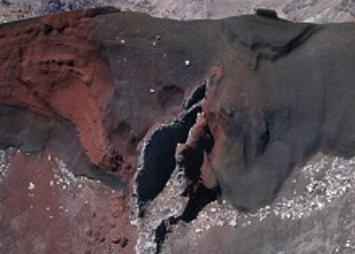 The rich ash colours of Red Crater surround a dramatic, hollow dike.