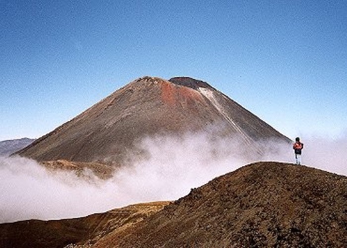 Mt. Ngauruhoe with clouds and hikers from above Red Crater